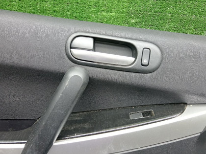 Обшивка двери передняя левая MAZDA CX-7 OEM E22368450B02 ER3P 2009